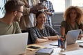 Group of young multicultural business people working together. Happy beautiful asian woman smiling at camera Royalty Free Stock Photo