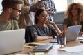 Group of young multicultural business people working together in modern office. Successful team talking, sharing ideas Royalty Free Stock Photo