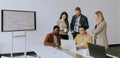 Group of multiethnic business people working together and preparing new project on a meeting in office Royalty Free Stock Photo