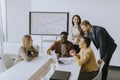 Group of multiethnic business people working together and preparing new project on a meeting in office Royalty Free Stock Photo