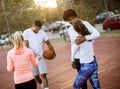 Group of multiethnic young people playing basketball on court Royalty Free Stock Photo