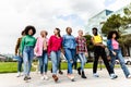 Group of young multiracial friends having fun hanging out together in the city Royalty Free Stock Photo