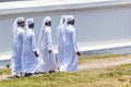 Group of young muslim men in white tunic