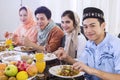 Muslim people eat together during breaks the fast