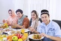 Muslim people enjoying meals at breaks the fast