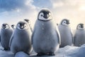A group of young penguins are standing in the snow. Penguin babies on the Antarctic snow