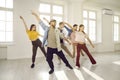 Group of happy young people having dancing class with dance instructor at the gym Royalty Free Stock Photo