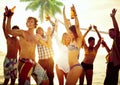 Group of Young People Celebrating by the Beach Royalty Free Stock Photo