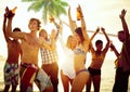 Group of Young People Celebrating by the Beach