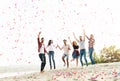 Group of young people celebrating at the beach