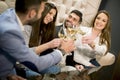 Group of young people celebrating and toasting with white wine Royalty Free Stock Photo