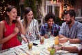 Group of young people with cocktails  having fun in nightclub celebrating. Fun, friendship, celebration concept Royalty Free Stock Photo