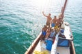 Group of young people dancing in sailing boat party with dj playing music - Top view of multiracial friends having fun in summer Royalty Free Stock Photo