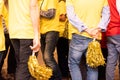 Group of young people divided into two teams dressed in colorful party shirts