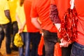 Group of young people divided into two teams dressed in colorful party shirts