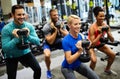 Group of friends smiling and enjoy sport in gym