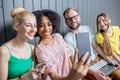 Group of young people with gadgets indoors Royalty Free Stock Photo