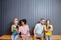 Group of young people with gadgets indoors Royalty Free Stock Photo