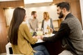 Group of young people having dinner and drinking wine in modern Royalty Free Stock Photo