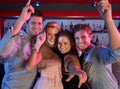 Group Of Young People Having Fun In Busy Bar Royalty Free Stock Photo