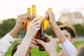 Group of young people having fun drinking beer at summer party outdoors Royalty Free Stock Photo