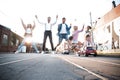 Group of young people having fun together outdoors in urban background. Royalty Free Stock Photo