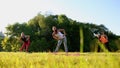 Group of young people having kick boxing training , outdoor