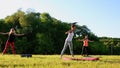 Group of young people having kick boxing training , outdoor