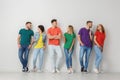 Group of young people in jeans and colorful t-shirts Royalty Free Stock Photo