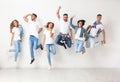 Group of young people in jeans jumping Royalty Free Stock Photo