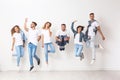 Group of young people in jeans jumping Royalty Free Stock Photo