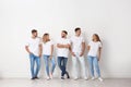 Group of young people in jeans near wall Royalty Free Stock Photo
