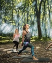 Group of young people keep in shape exercising in forest Royalty Free Stock Photo