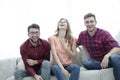 Group of young people laughing and sitting on the couch Royalty Free Stock Photo