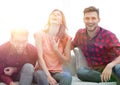 Group of young people laughing and sitting on the couch Royalty Free Stock Photo