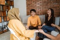 Group of young people laughing together while holding hands with friends Royalty Free Stock Photo