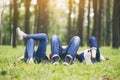 A group of young people lying down on a green grass Royalty Free Stock Photo