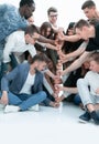 Group of young people making a tower of fists. Royalty Free Stock Photo