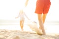 Group of young people playing with ball at the beach. Young friends enjoying summer holidays on a sandy beach Royalty Free Stock Photo