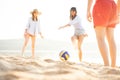 Group of young people playing with ball at the beach. Young friends enjoying summer holidays on a sandy beach Royalty Free Stock Photo