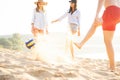 Group of young people playing with ball at the beach. Young friends enjoying summer holidays on a sandy beach Royalty Free Stock Photo