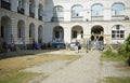 Group of young people preparing stage for performance of a street theatre in the yard of an old abandoned building. Kyiv, Ukraine Royalty Free Stock Photo