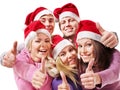 Group young people in santa hat show thumbs up. Royalty Free Stock Photo