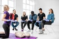 Group of young people sitting during the first aid training Royalty Free Stock Photo