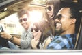 Group of young people smiling in car Royalty Free Stock Photo