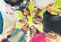 Group of young people standing in a circle, outdoors Royalty Free Stock Photo