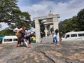 Group of Young people standing at entrance rock or stone of the Gavi Gangadareshwara Temple and a Protected Ancient Monument