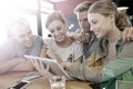 Group of young people on a tablet