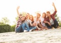 Group of young people taking a selfie outdoors on the beach Royalty Free Stock Photo