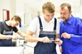 Group of young people in technical vocational training with teacher Royalty Free Stock Photo